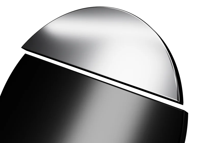 Close view of the platinum segment of the Aperture object, catching studio light.